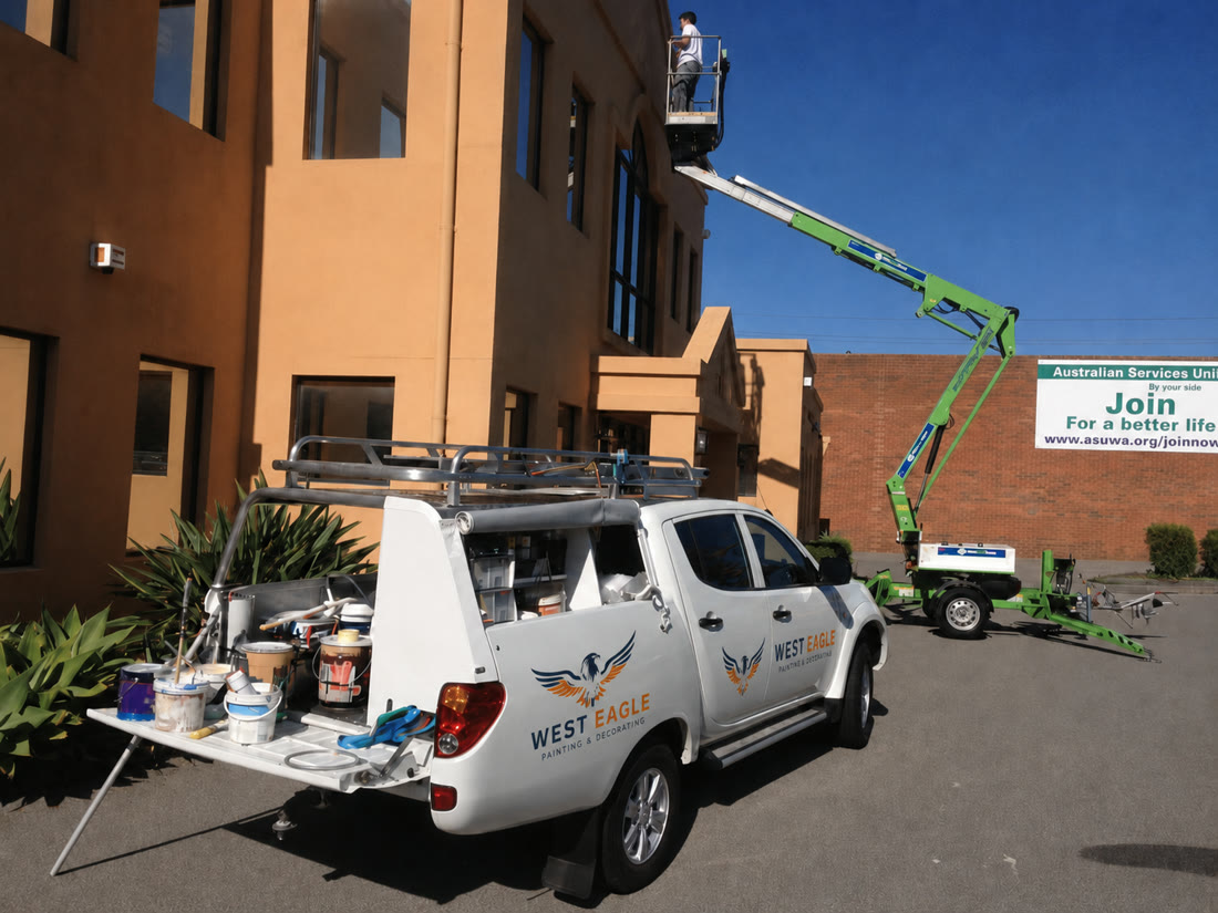 West Eagle branded ute and boom lift on an exterior painting job